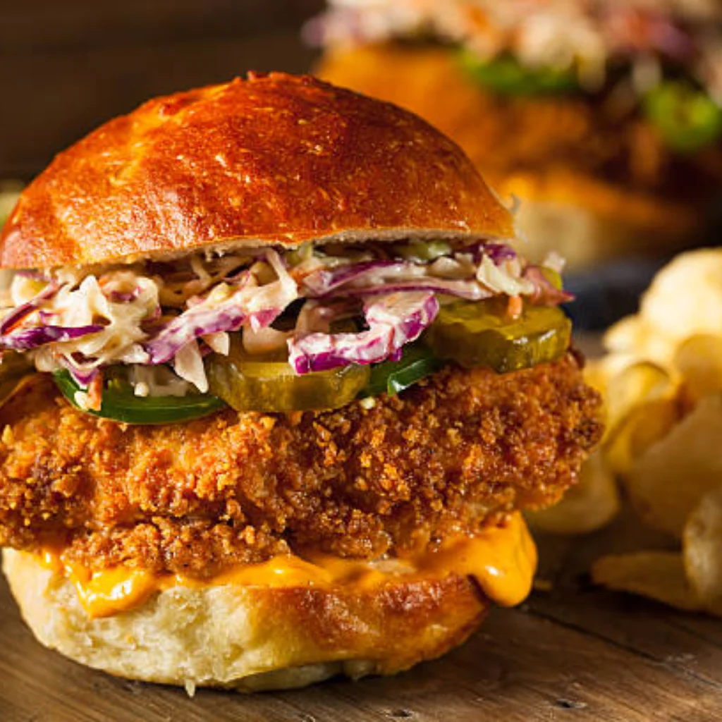 Grilled chicken burger stacked with fresh fixings