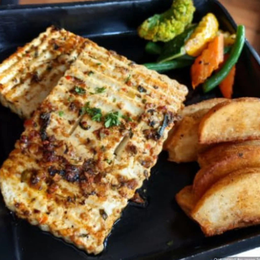 Grilled cottage cheese steak with char marks