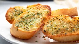 Golden toasted garlic bread, brushed with herb butter