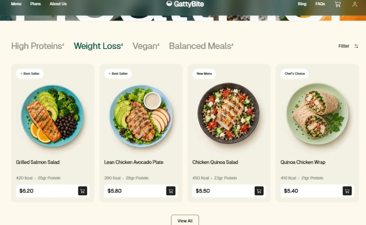 Four desktop meal cards with aligned photographs, nutrition details, prices, and cart buttons